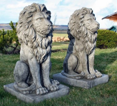 Two cast garden lions, very large and heavy ornaments.